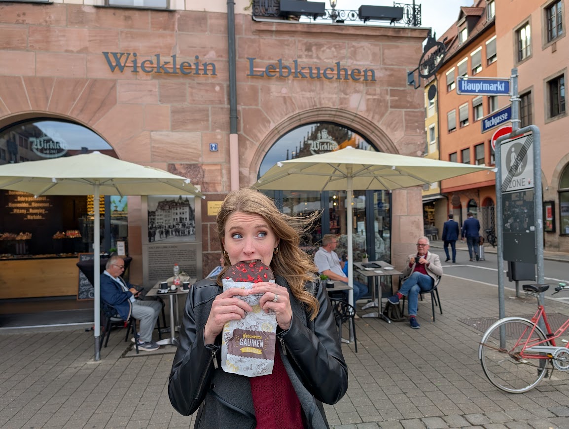 Joy eating lebkuchen in Nuremberg outside the Wicklein Lebkuchen store.