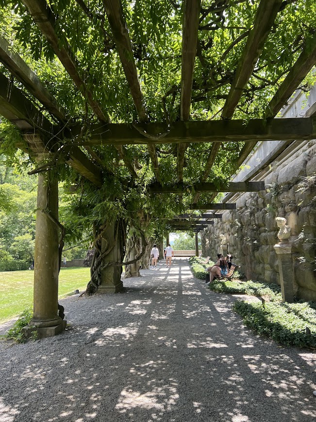 A covered walkway at the Biltmore in Asheville, NC, on a sunny day.