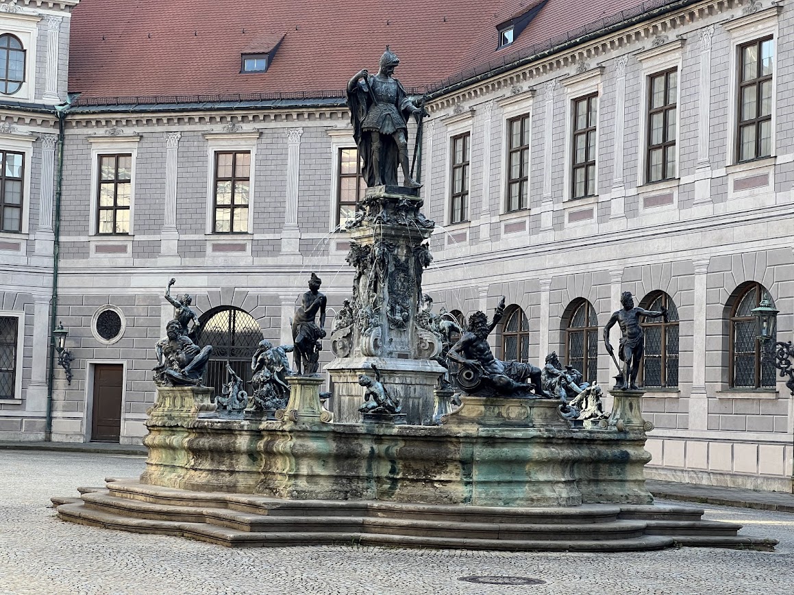 Fountain in the courtyard of the Munich Residence on a bright evening