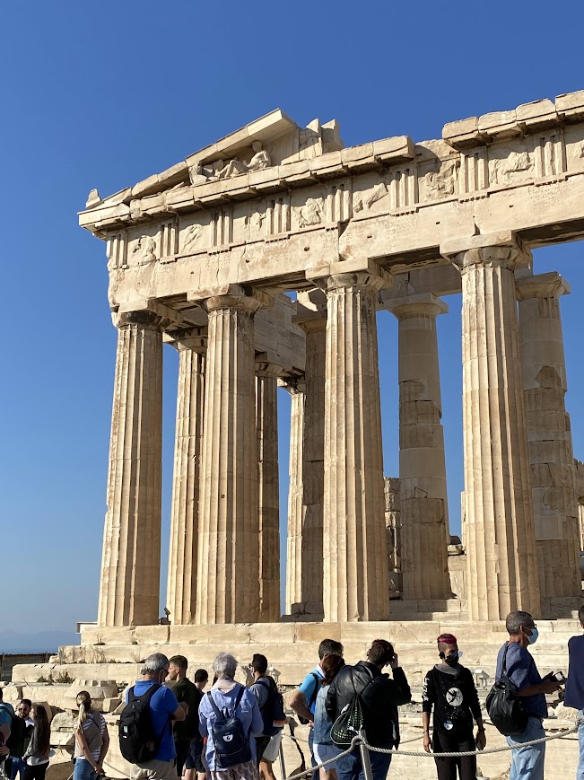 A corner of the Parthenon in Athens on a bright, cloudless fall day.