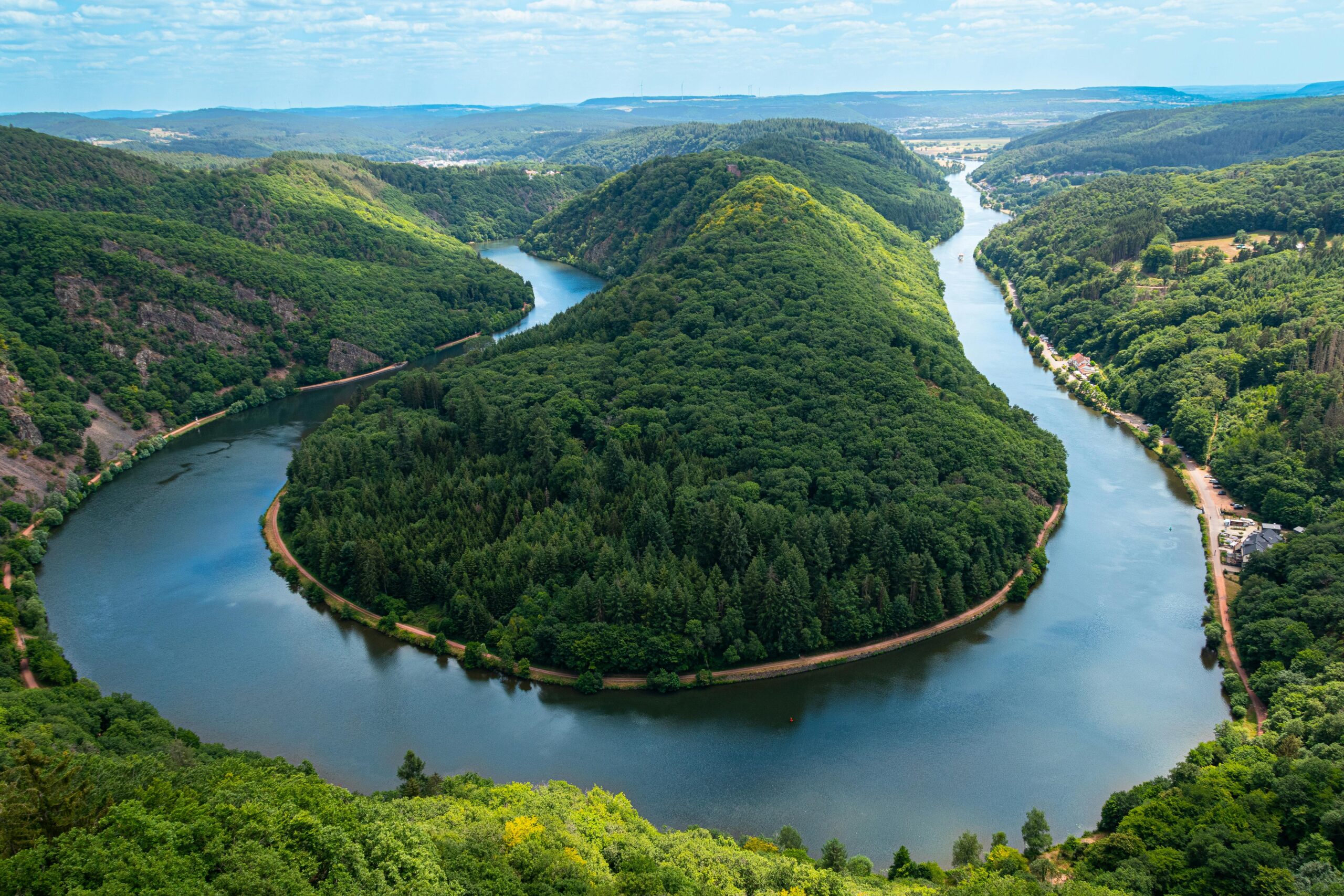 Stunning aerial view of the Saar Loop in Saarland with lush greenery in Mettlach, Germany.
